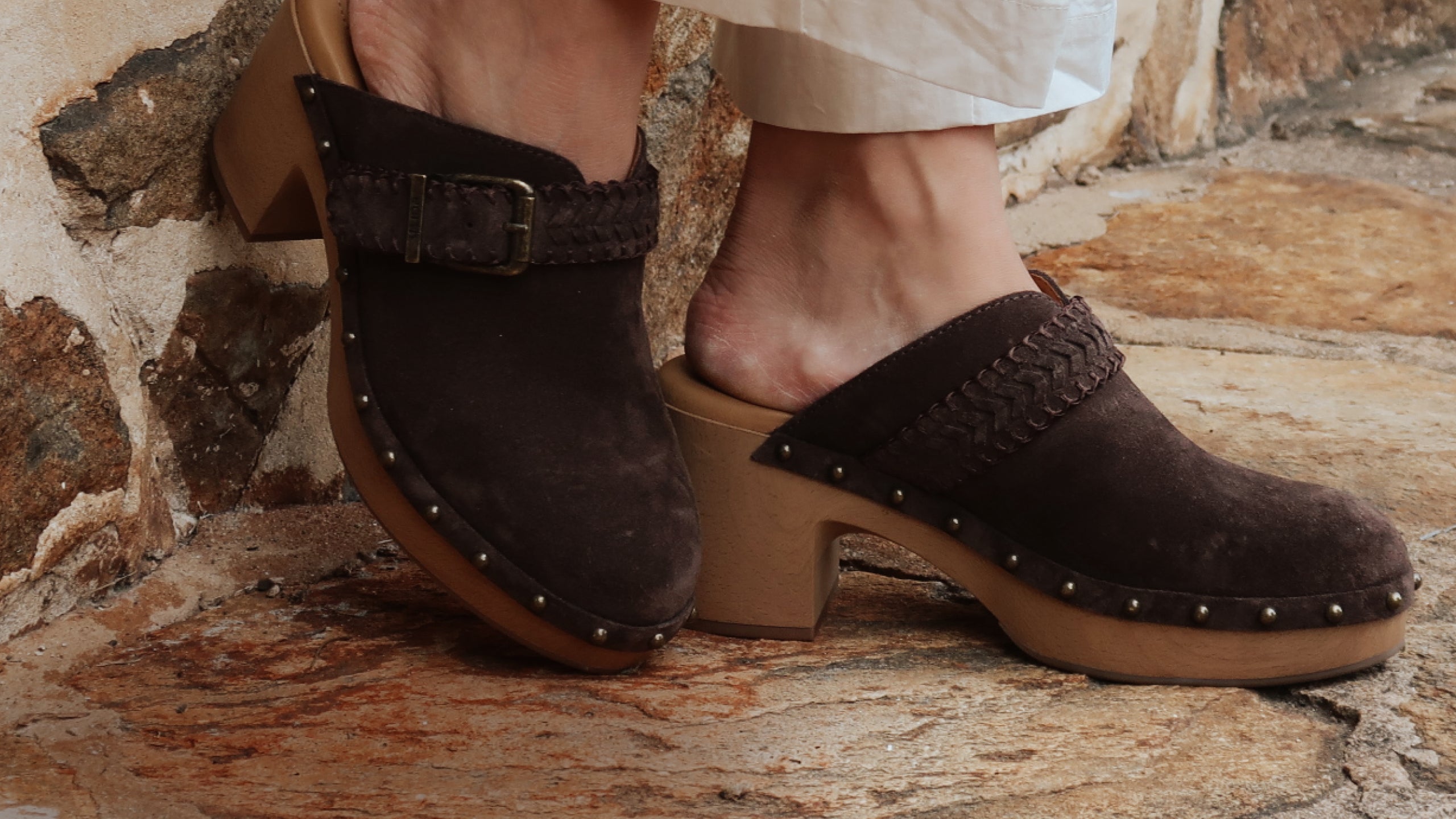 Promotional banner featuring studded clogs
